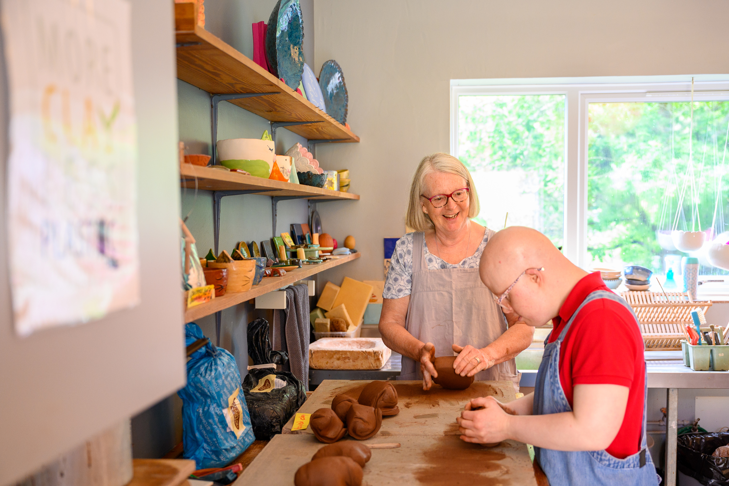 Preparing clay in our pottery workshop