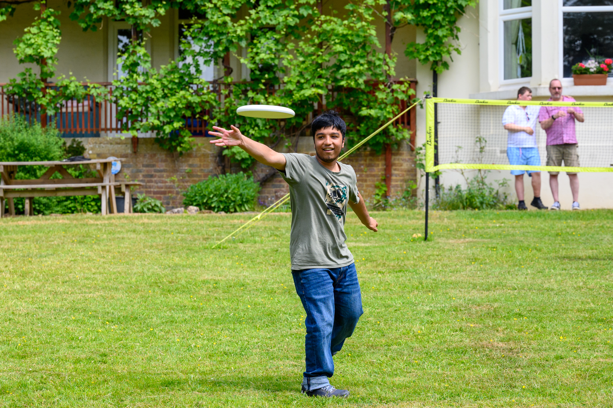 A student throwing a frisbee 