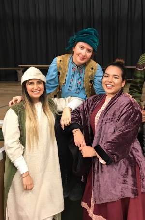 Three volunteers in costume for The Shepherd's Play