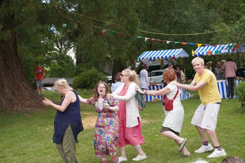 Community members enjoying the conga